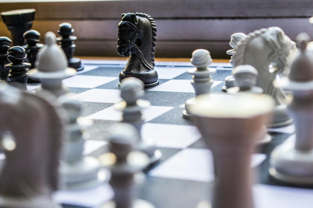 Close-up of a chessboard with pieces in focus, highlighting strategic gameplay.